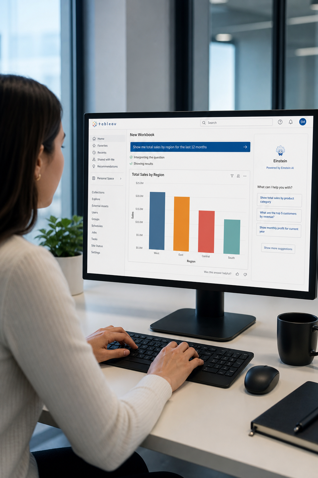 A photorealistic view of a business analyst typing a question into a Tableau dashboard, with a chart automatically appearing. The scene shows a modern office with soft lighting and a clean desk. Alt: Business analyst using Tableau Einstein natural language query.