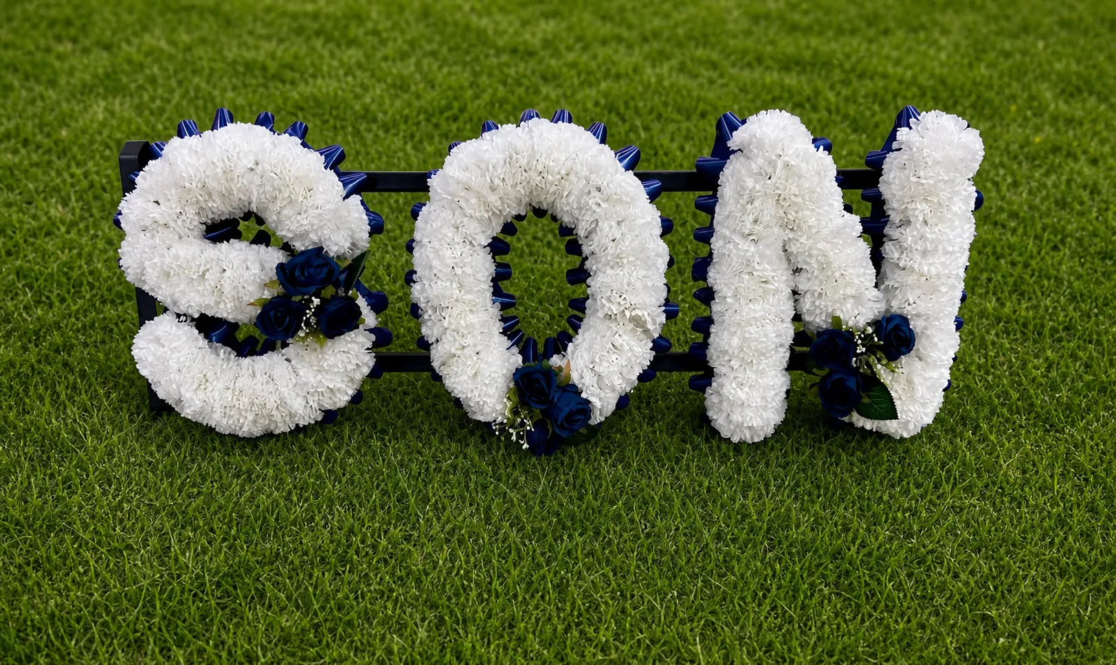 Heart-shaped funeral flowers and gates of heaven memorial tribute in Petts Wood.