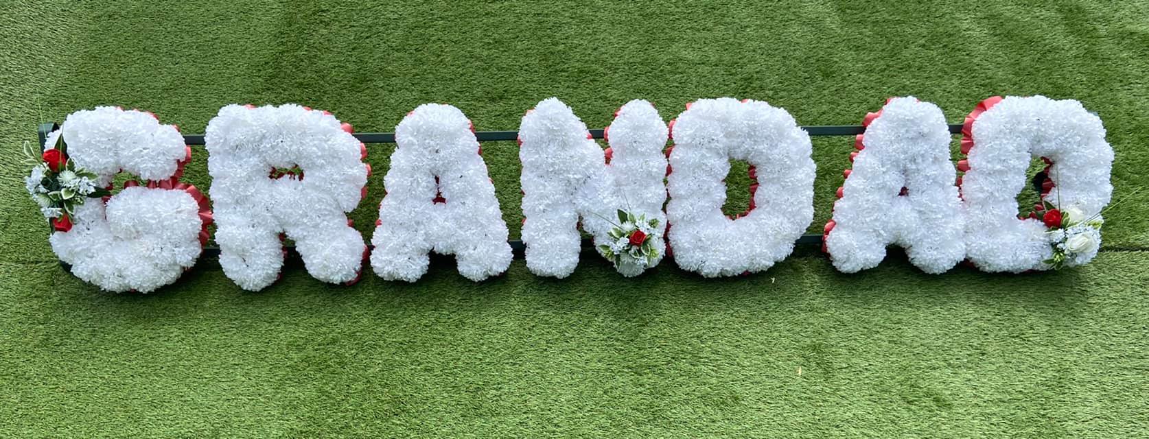 heart-shaped grave flowers at a Sidcup cemetery