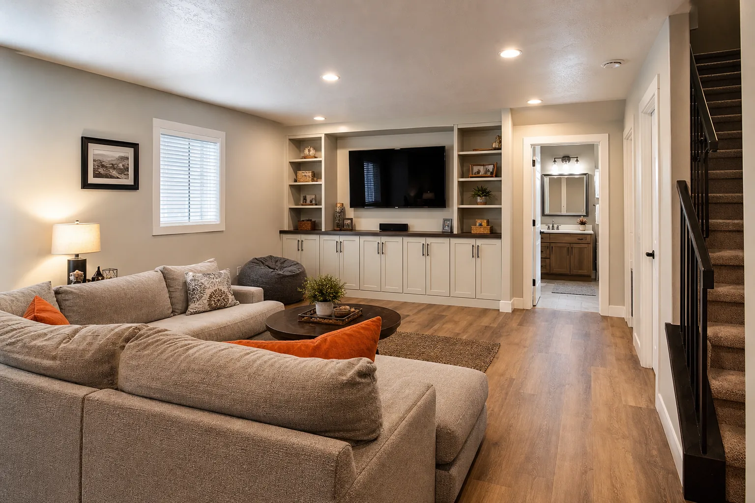 Finished Utah basement family room with modern flooring and storage