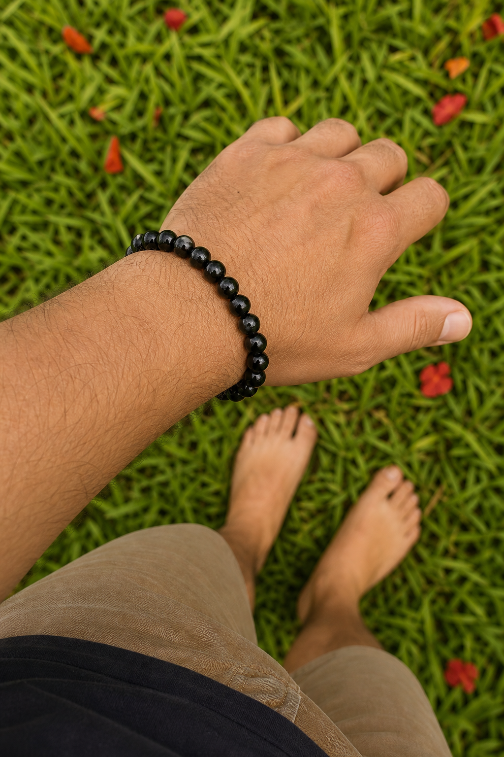 black obsidian bracelet grounding on grass