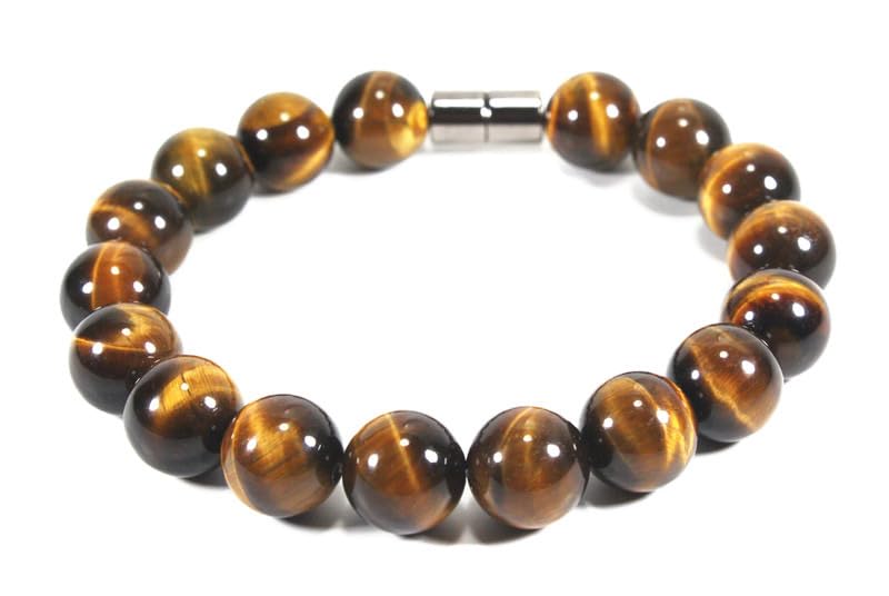 A photorealistic close‑up of a handcrafted tiger eye bracelet on a wooden wrist, natural light highlighting the golden b