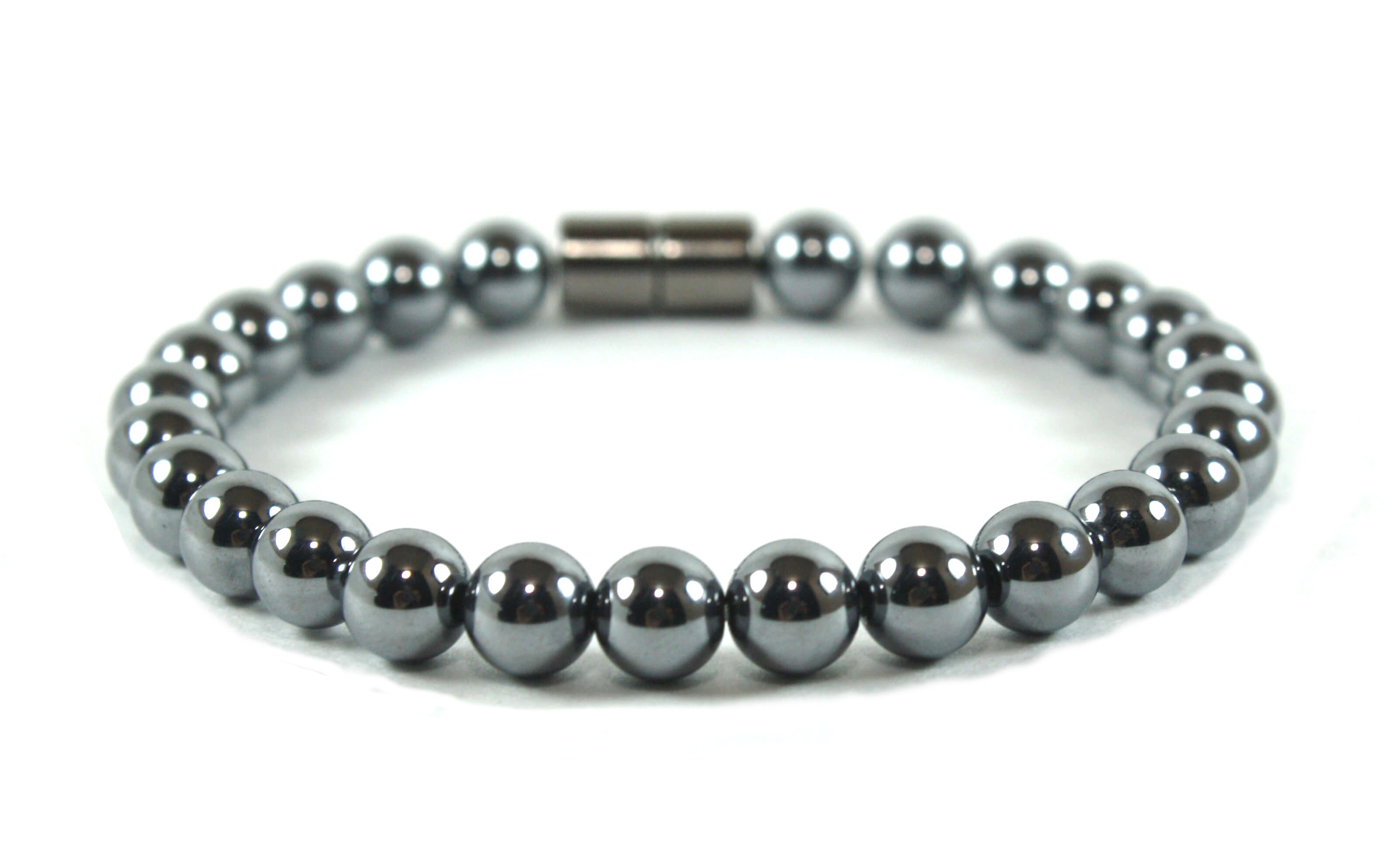 A photorealistic close-up of a handcrafted crystal bracelet lying on a wooden surface, soft natural light highlighting t