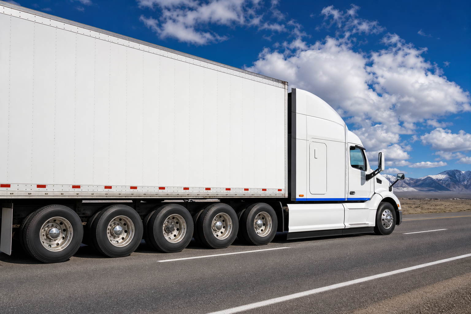 A realistic photo of a heavy‑duty truck on an open highway, side view showing perfectly aligned wheels and clean tire tr