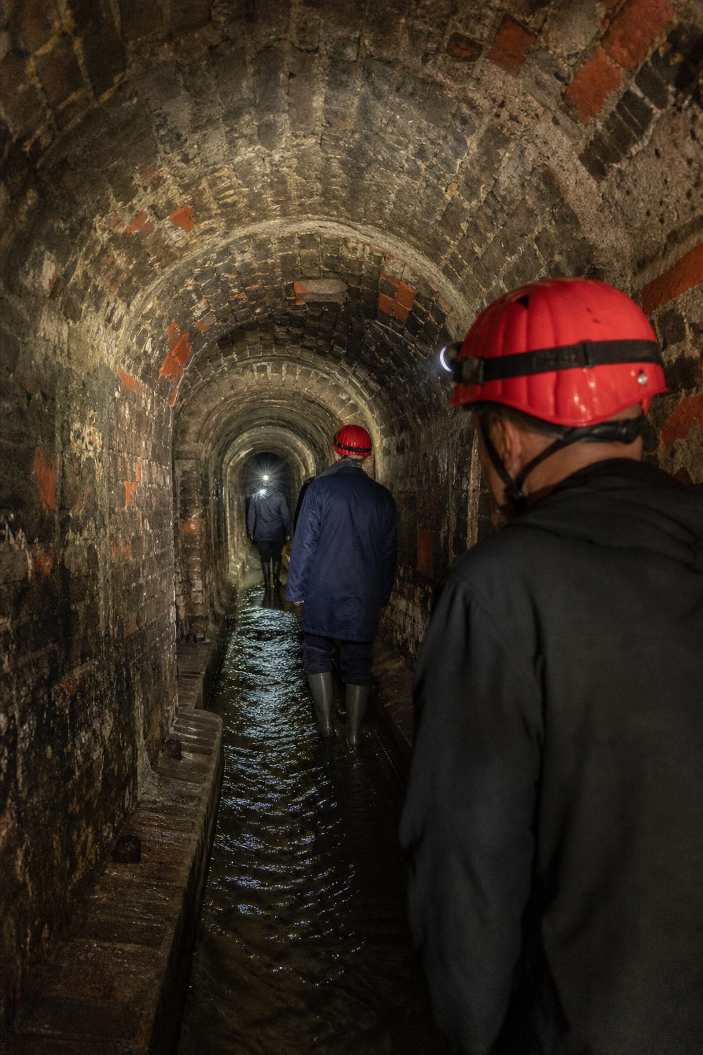 Vienna underground sewer tour historic tunnel interior.