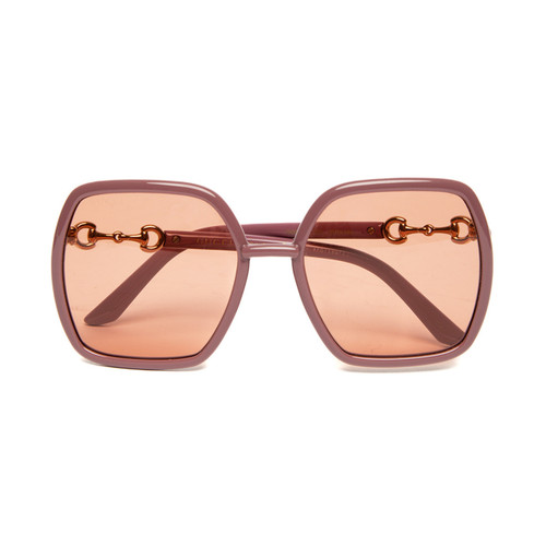 A photorealistic editorial image related to designer sunglasses women. Alt: designer sunglasses women