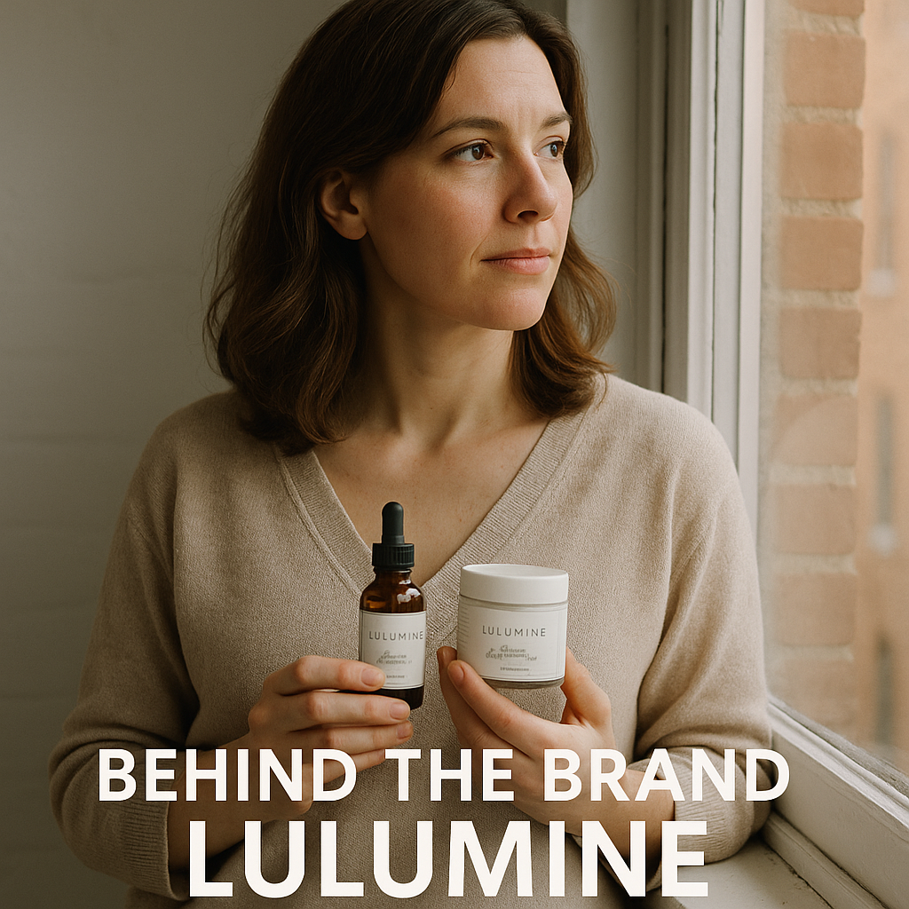 Founder reflecting by a window with natural light, holding Lulumine products. Alt: behind the brand Lulumine founder story with founder holding organic skincare products.
