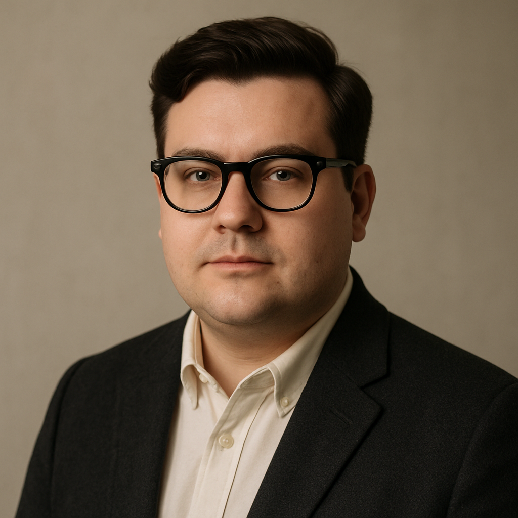 A stylish man with a round face wearing classic black wayfarer eyeglasses, standing against a neutral indoor background. Alt: Classic wayfarer frames for round face men, adding angular contrast.