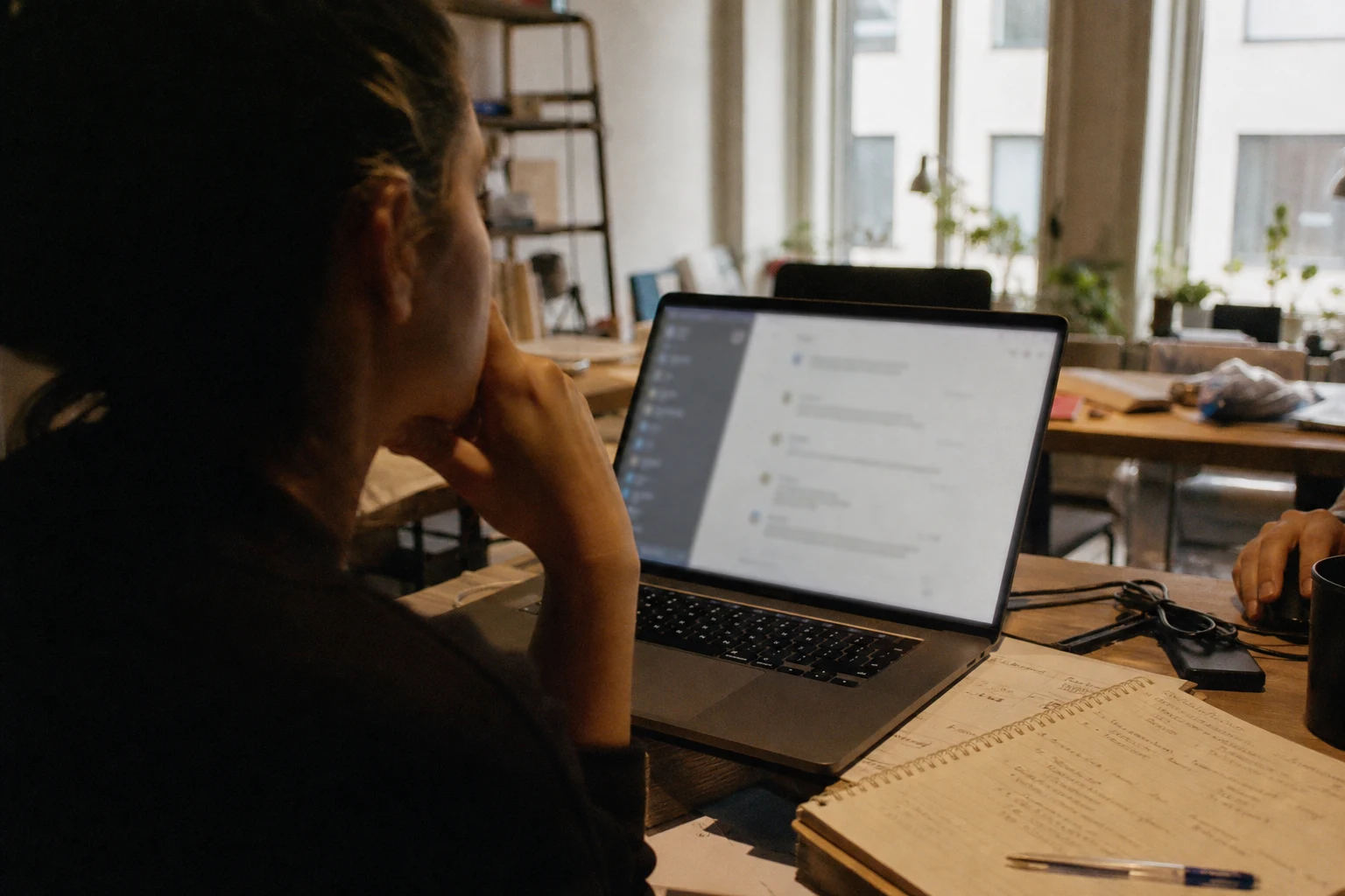 Best Content Strategy Agency Services 8 Documentary-style photo of a marketer reviewing an AI answer interface on a laptop