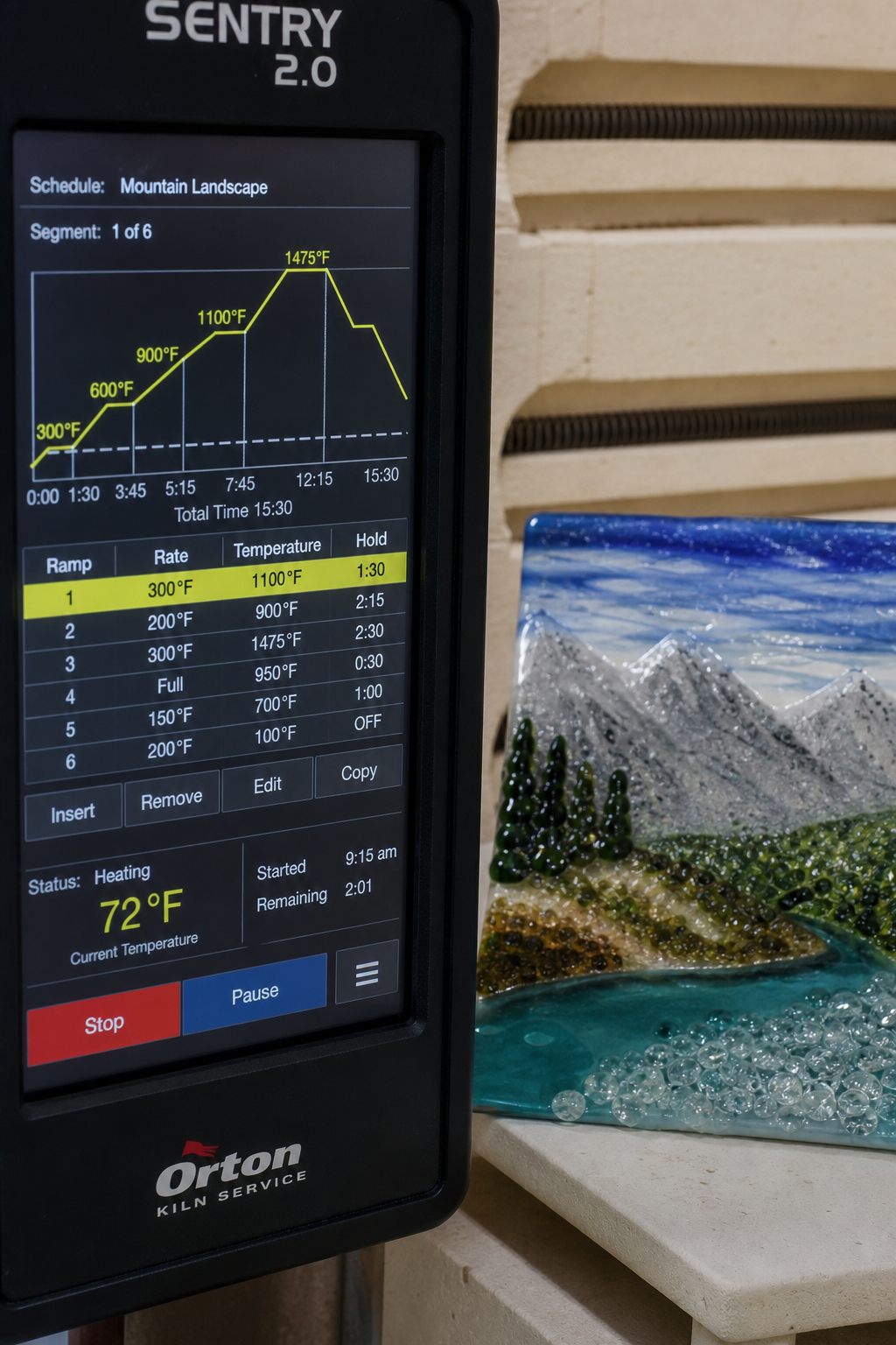 A photorealistic close-up of a digital kiln controller display showing a multi-segment firing schedule with ramps and holds, next to a partially fused glass landscape piece on a kiln shelf. Alt: kiln controller with advanced firing schedule for glass fusing advanced workshop online.