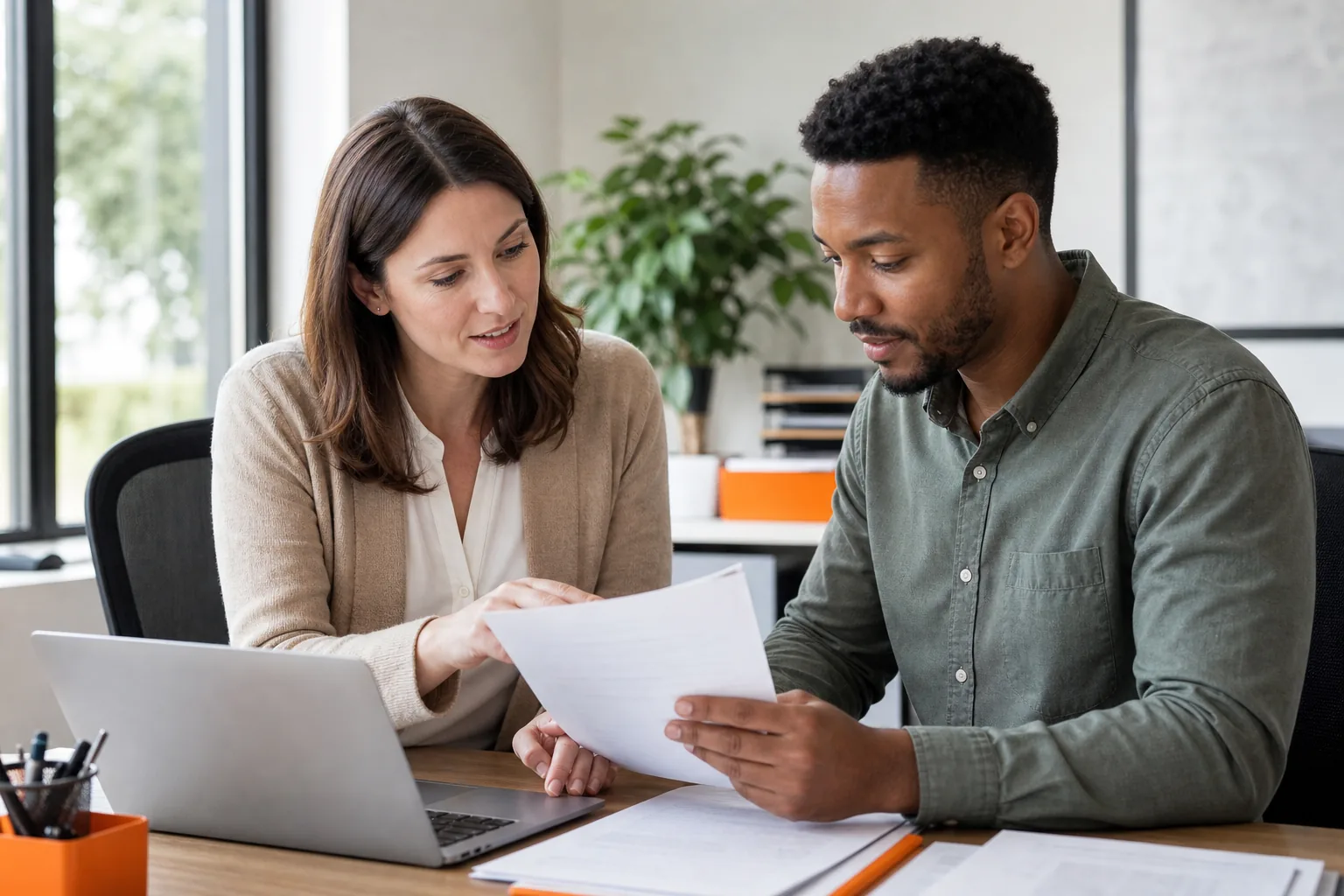 Employee completing small business health insurance enrollment forms with HR support.