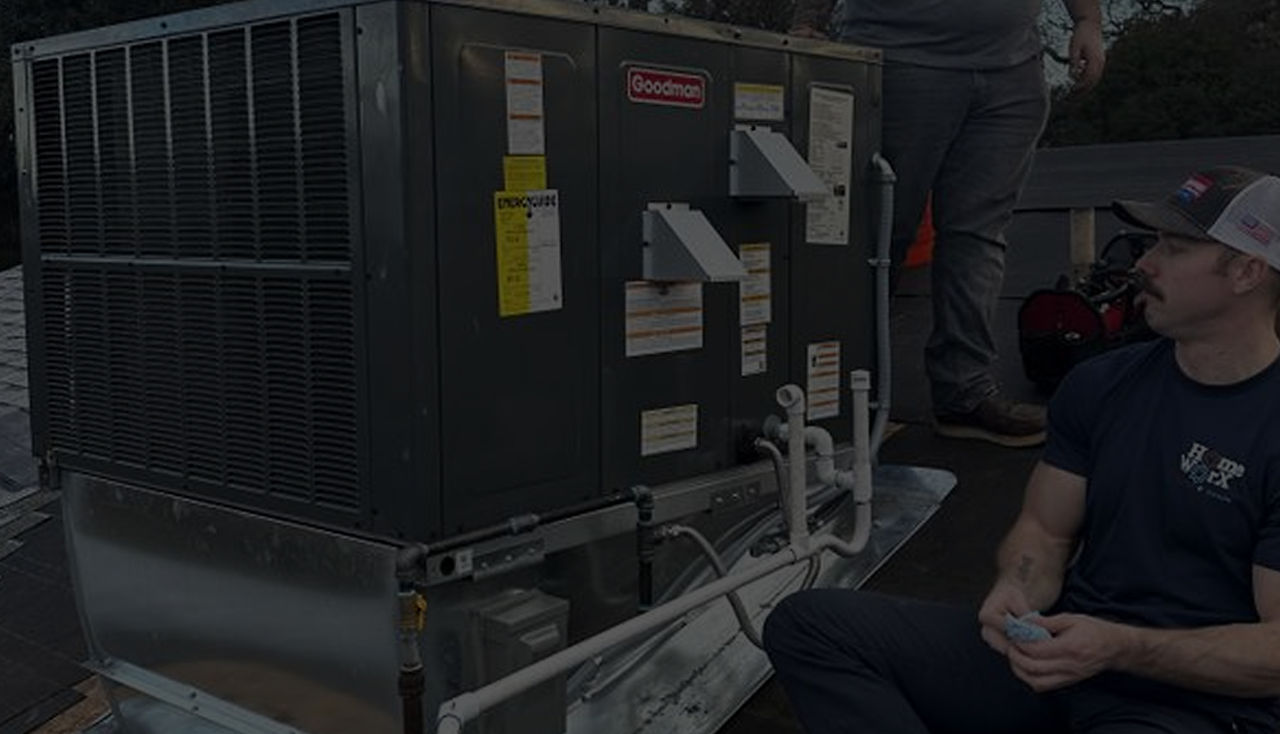 A photorealistic scene of a friendly HVAC technician in a navy uniform inspecting a heat pump unit mounted on the side of a California ranch-style home, with pine trees and golden foothills in the background under a bright blue sky. Alt: HVAC technician from Home Worx Heating and Cooling inspecting a heat pump installation in Placer County California.